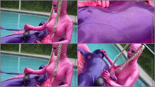 Femdom –   Kinky Rubber World, Lara playing with Rubber Jeff in Latex Blindmask on the Pool Float